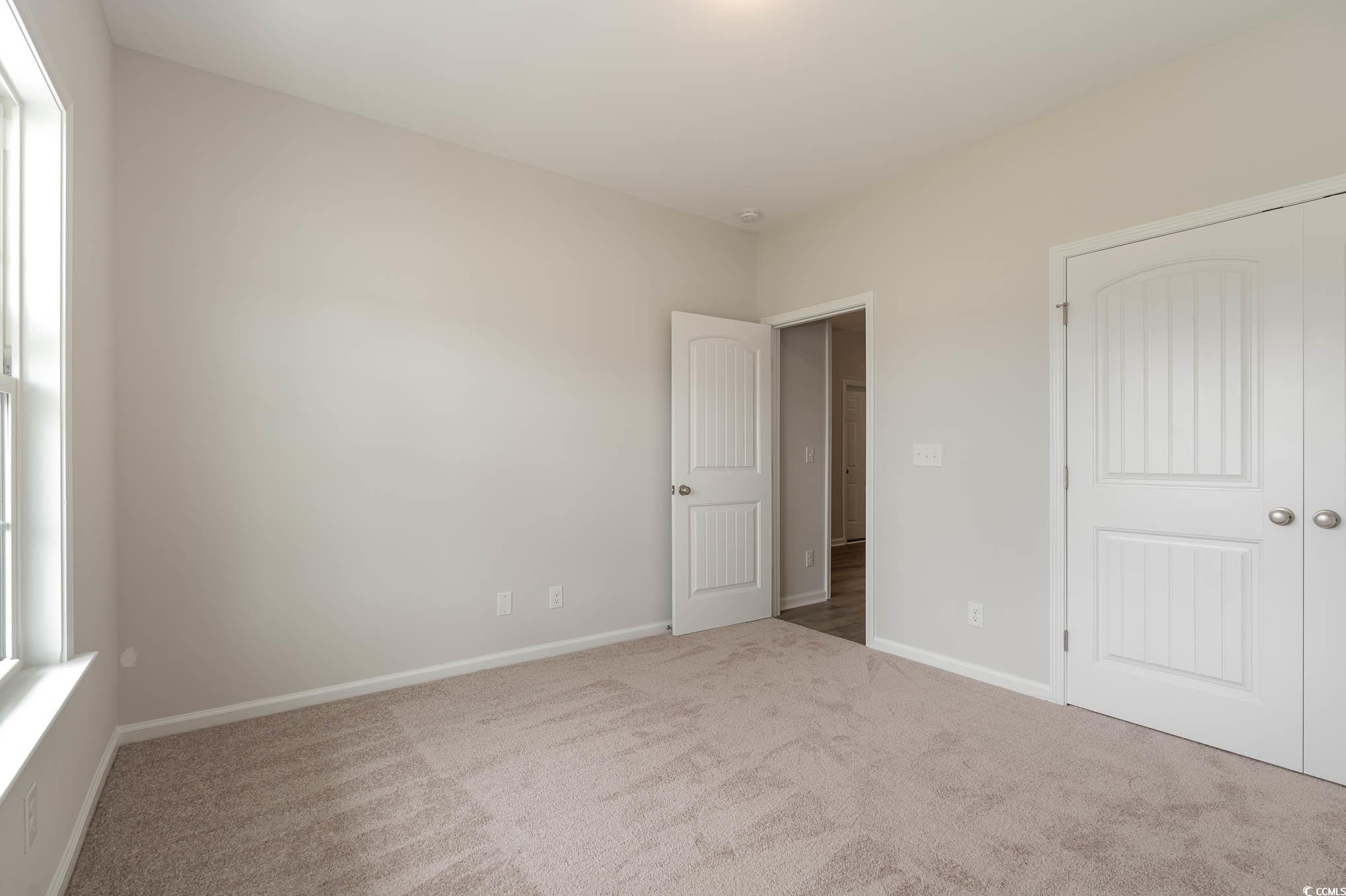 1308 Crooked Hook Road North Myrtle Beach, SC 29582 - Photo 6 of 23 Unfurnished room featuring carpet