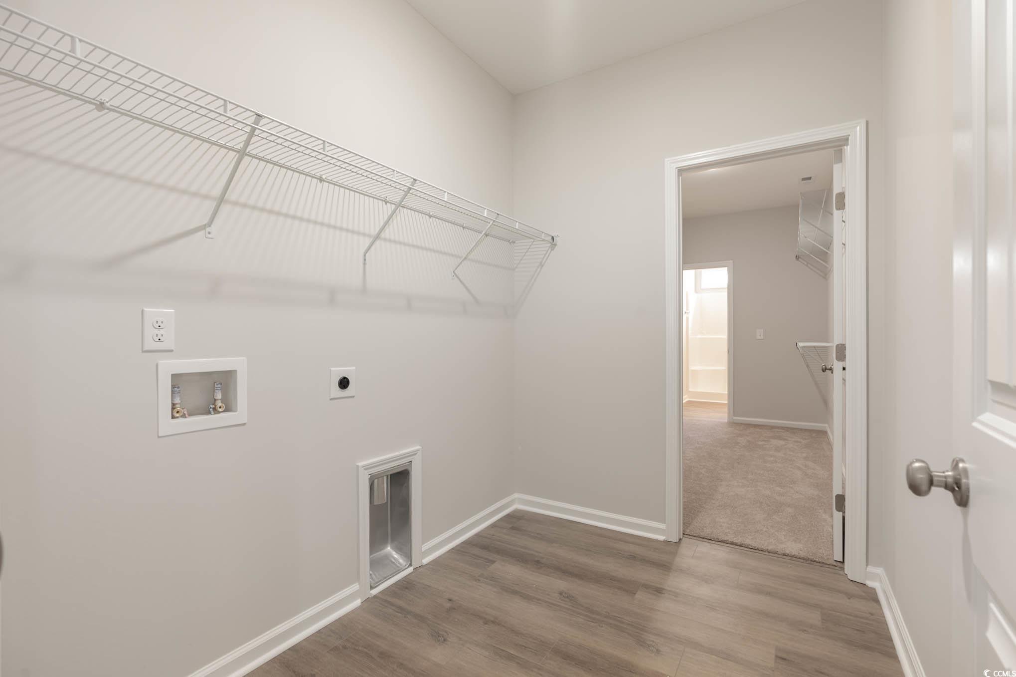 1308 Crooked Hook Road North Myrtle Beach, SC 29582 - Photo 10 of 23 Walk in closet with light carpet