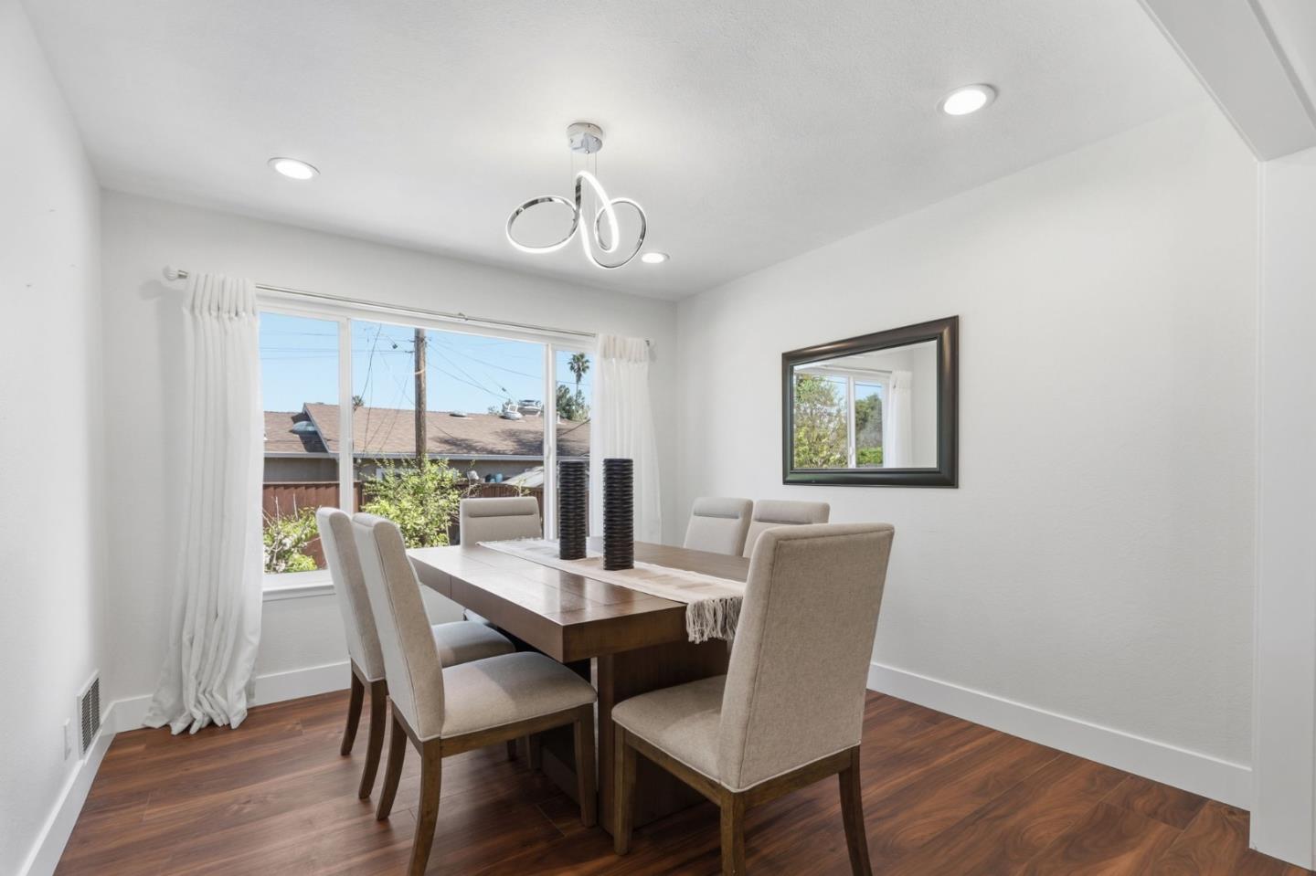 5888 Lean Way San Jose, CA 95123 - Photo 29 of 54 a view of a dining room with furniture window and wooden floor