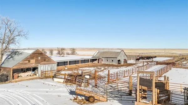 a view of a terrace with chairs and a table