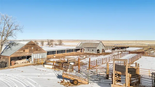 a view of a terrace with chairs and a table