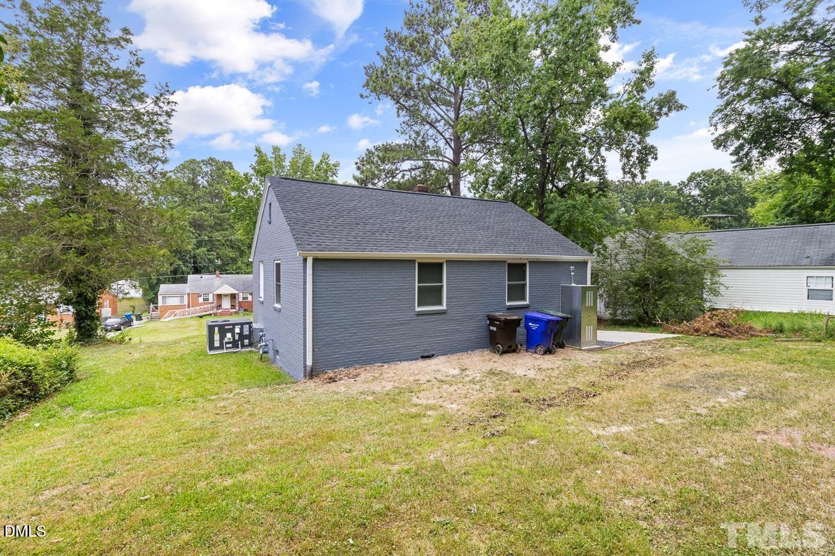 2509 White Oak Avenue Durham, NC 27707 - Photo 15 of 15 a view of a house with a patio and a yard
