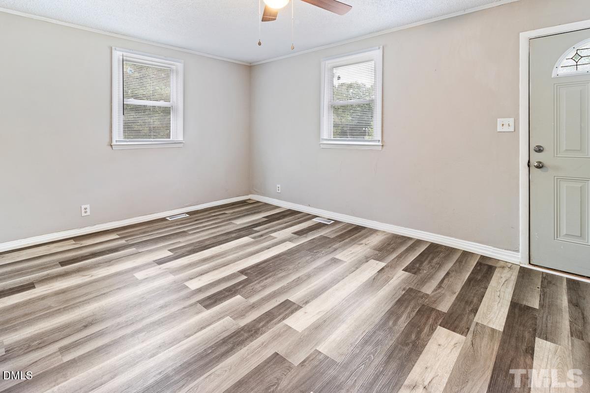2509 White Oak Avenue Durham, NC 27707 - Photo 4 of 15 a view of room with window and ceiling fan