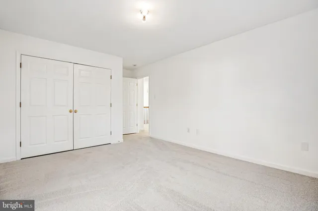 an empty room with white cabinet