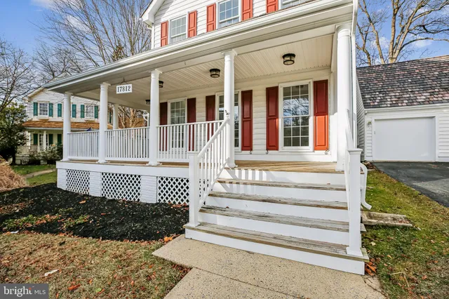 a front view of a house with a floor to a yard