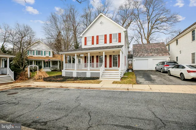 a front view of residential houses with yard