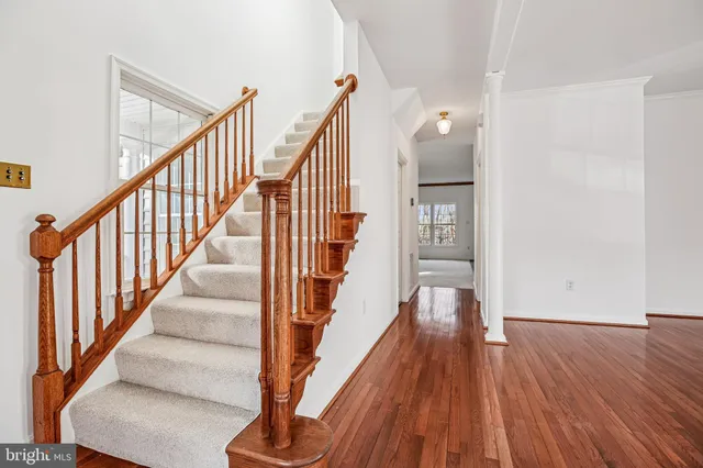 a view of staircase with wooden floor and staircase
