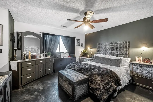 a bedroom with a bed and a dresser