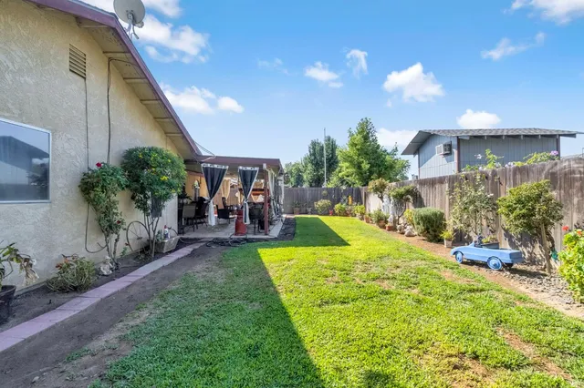 a view of a house with a yard porch and sitting area