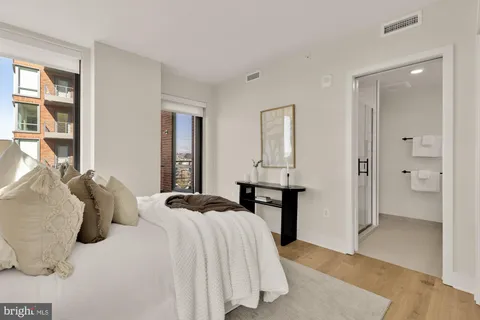 a bedroom with a bed and walk in closet