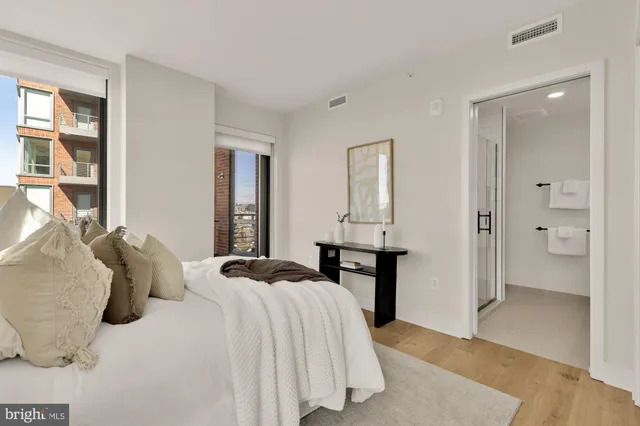 a bedroom with a bed and walk in closet