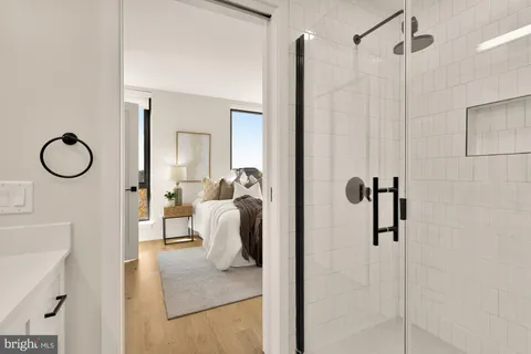 a bedroom with a bed and a lamp