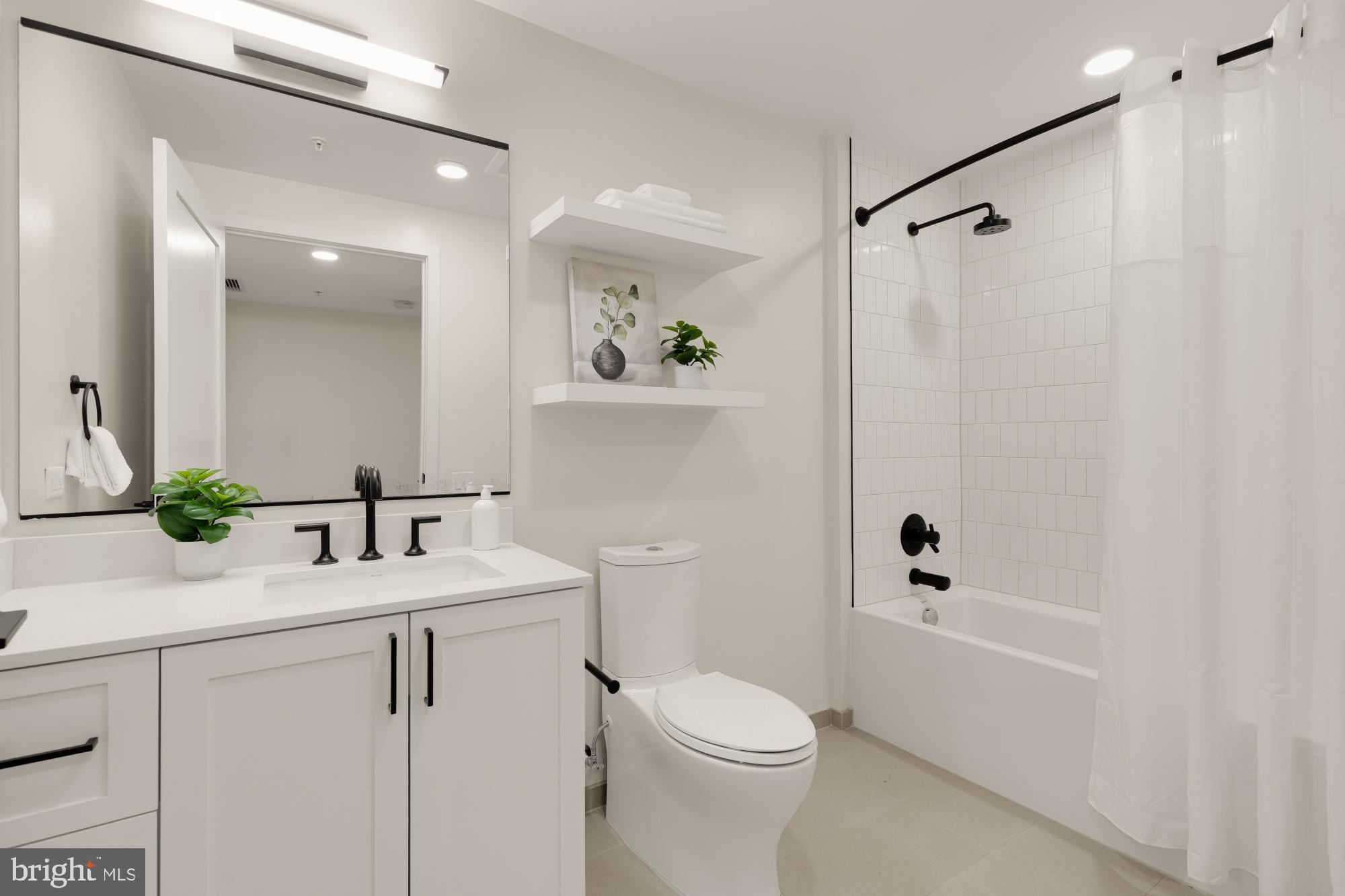 1211 Van Street Southeast, Unit 718 Washington, DC 20003 - Photo 22 of 43 a bathroom with a sink toilet and shower