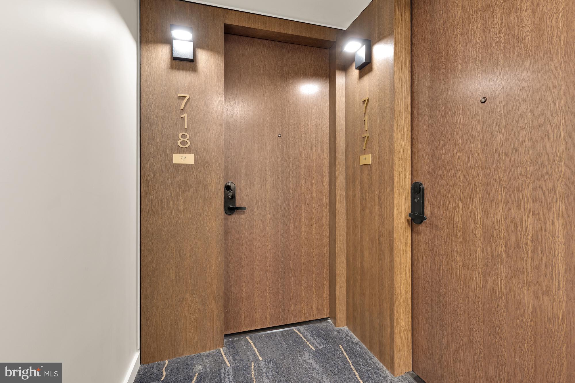 1211 Van Street Southeast, Unit 718 Washington, DC 20003 - Photo 25 of 43 a view of a hallway with wooden floor