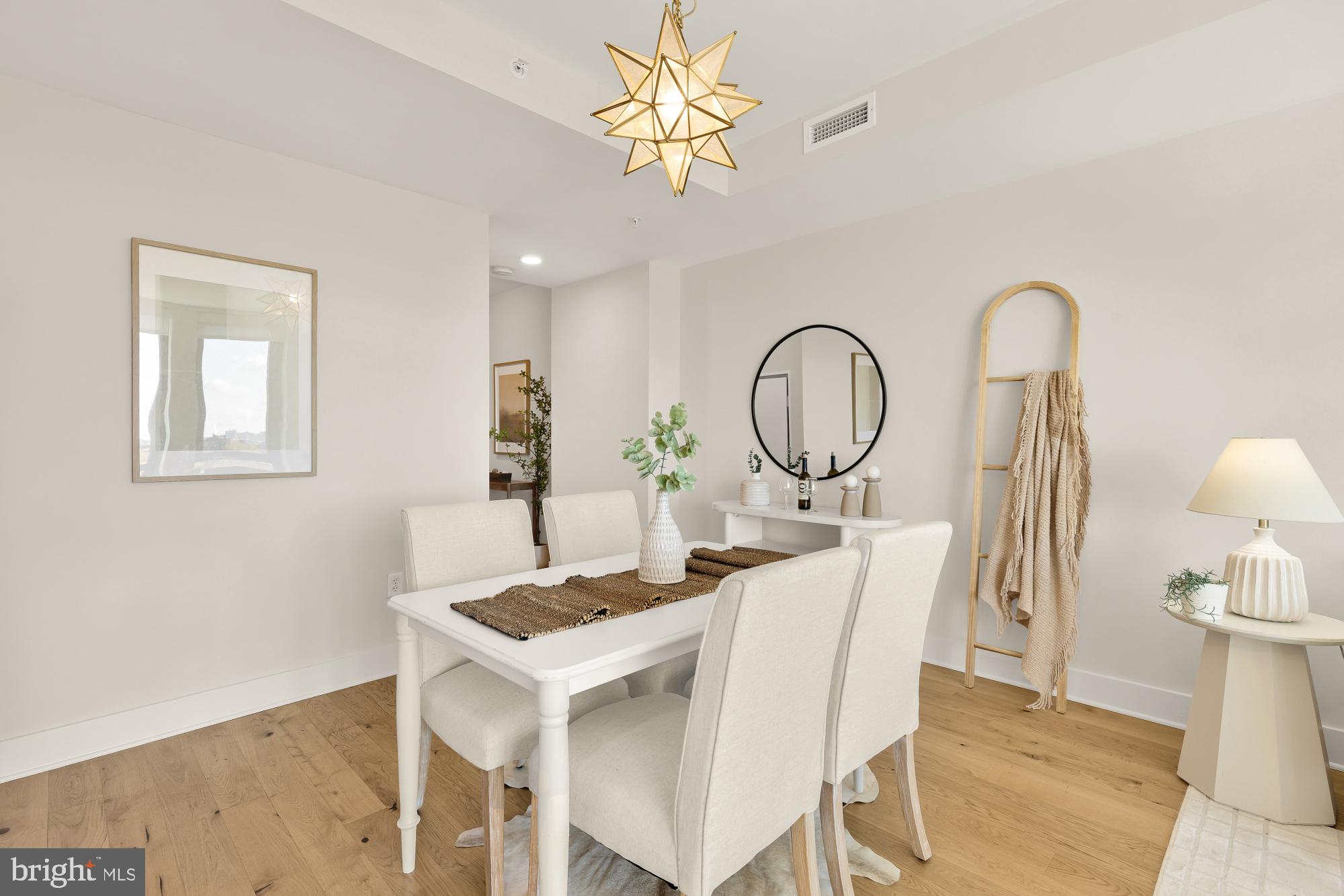1211 Van Street Southeast, Unit 718 Washington, DC 20003 - Photo 9 of 43 a view of a dining room with furniture and a chandelier