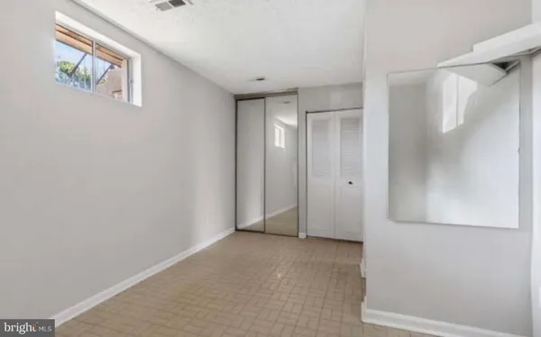 a view of a kitchen cabinets and a sink