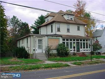 911 Stone Road Laurel Springs, NJ 08021 - Photo 2 of 2 a house that has a tree in front of it