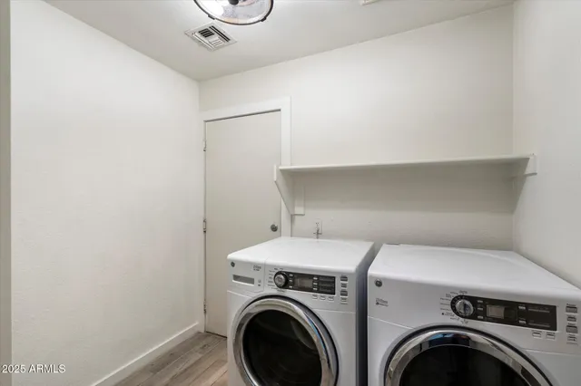 an aerial view of residential houses and outdoor space