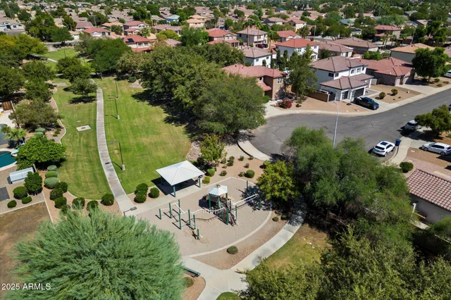 an aerial view of residential houses with outdoor space