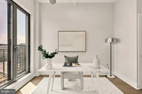a view of a hallway with washer and dryer
