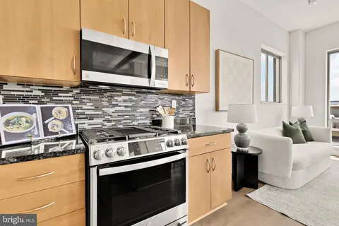 a kitchen with a stove and a microwave