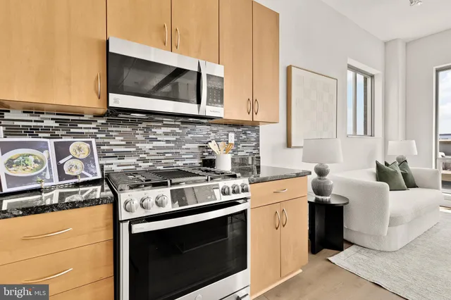 a kitchen with a stove and a microwave