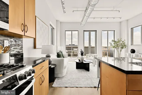 a kitchen with sink stove and refrigerator
