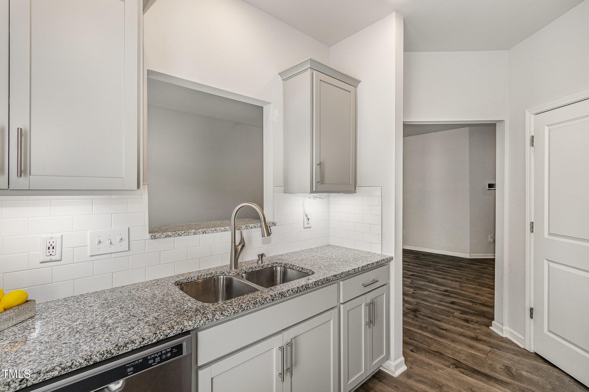 1230 Adrian Court Mebane, NC 27302 - Photo 9 of 31 a kitchen with granite countertop a sink and cabinets