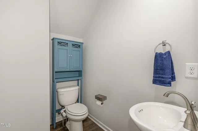 a kitchen with granite countertop a stove microwave and refrigerator
