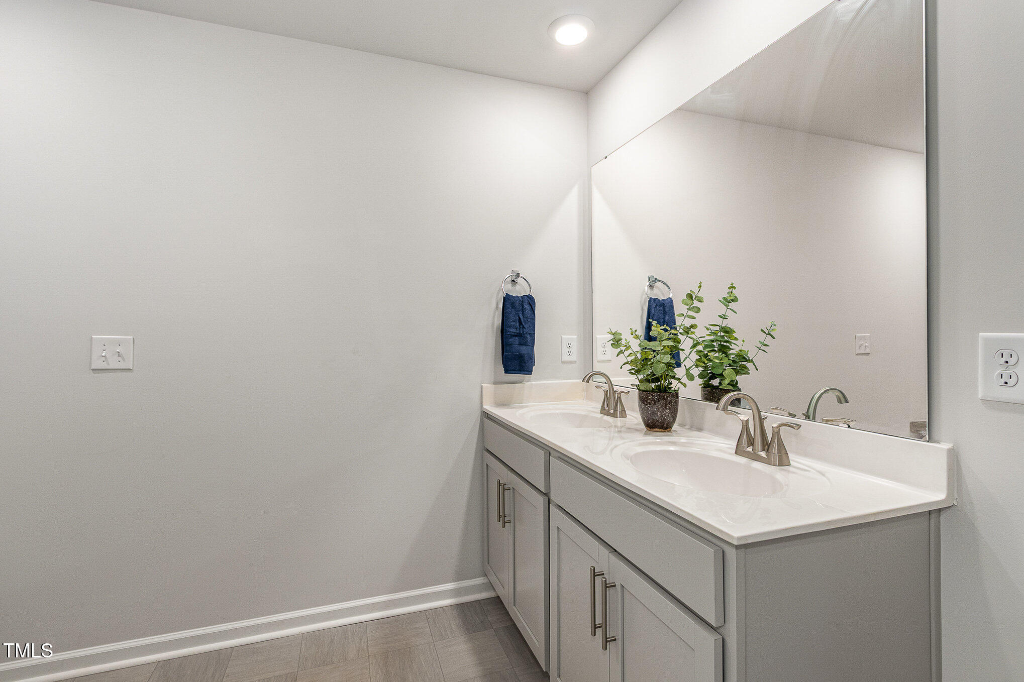 1230 Adrian Court Mebane, NC 27302 - Photo 18 of 31 a bathroom with a sink and a mirror