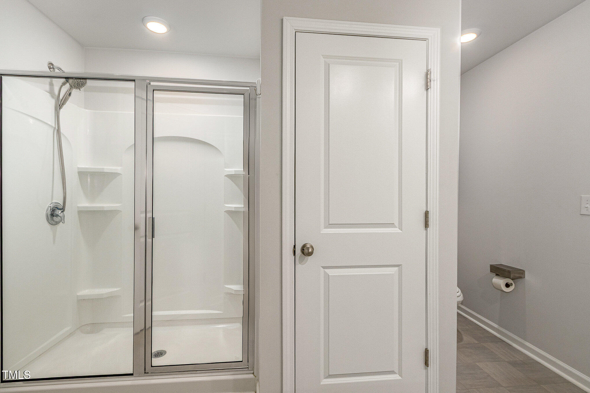 1230 Adrian Court Mebane, NC 27302 - Photo 19 of 31 a bathroom with a glass shower door