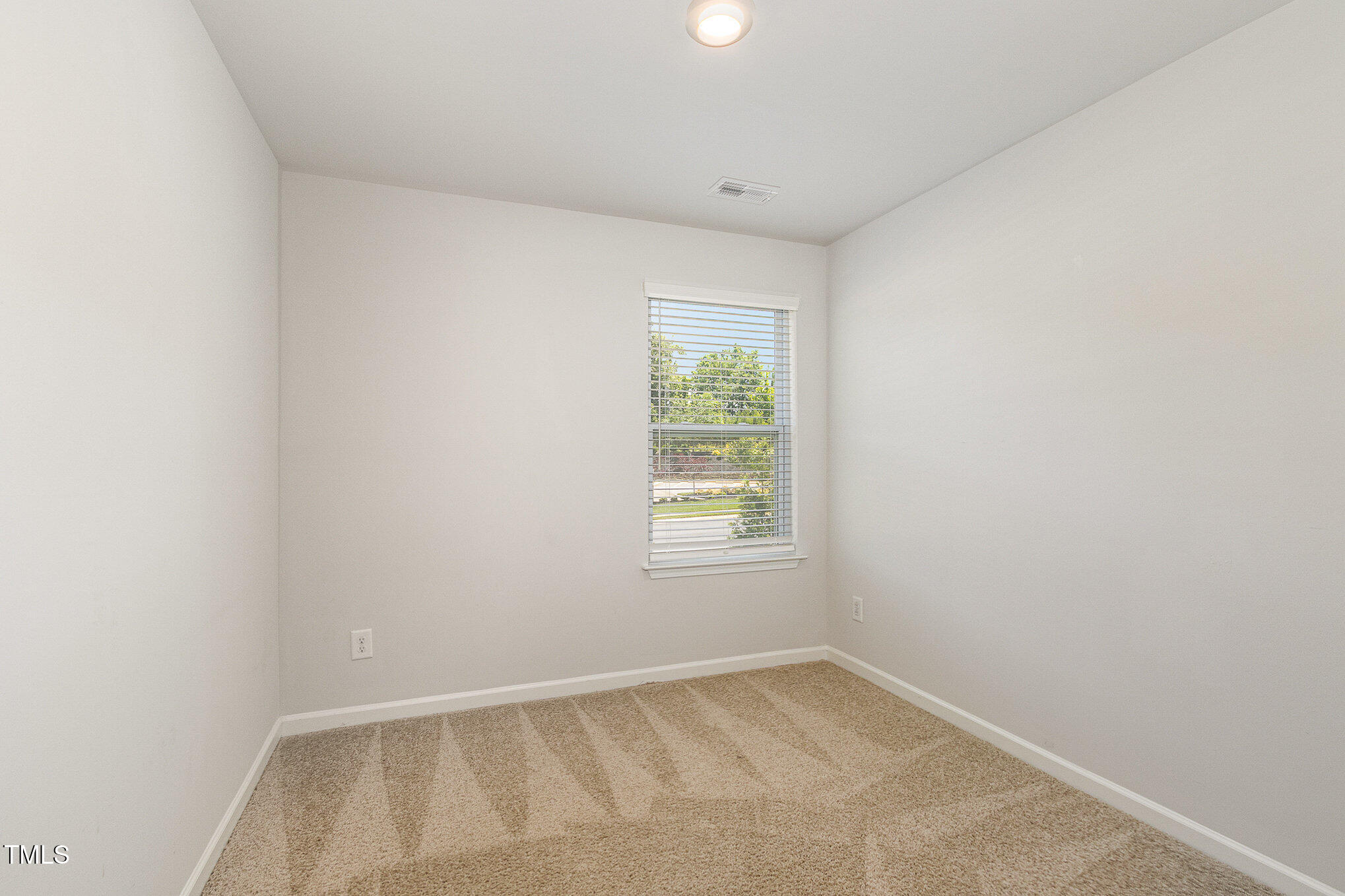 1230 Adrian Court Mebane, NC 27302 - Photo 22 of 31 an empty room with a window