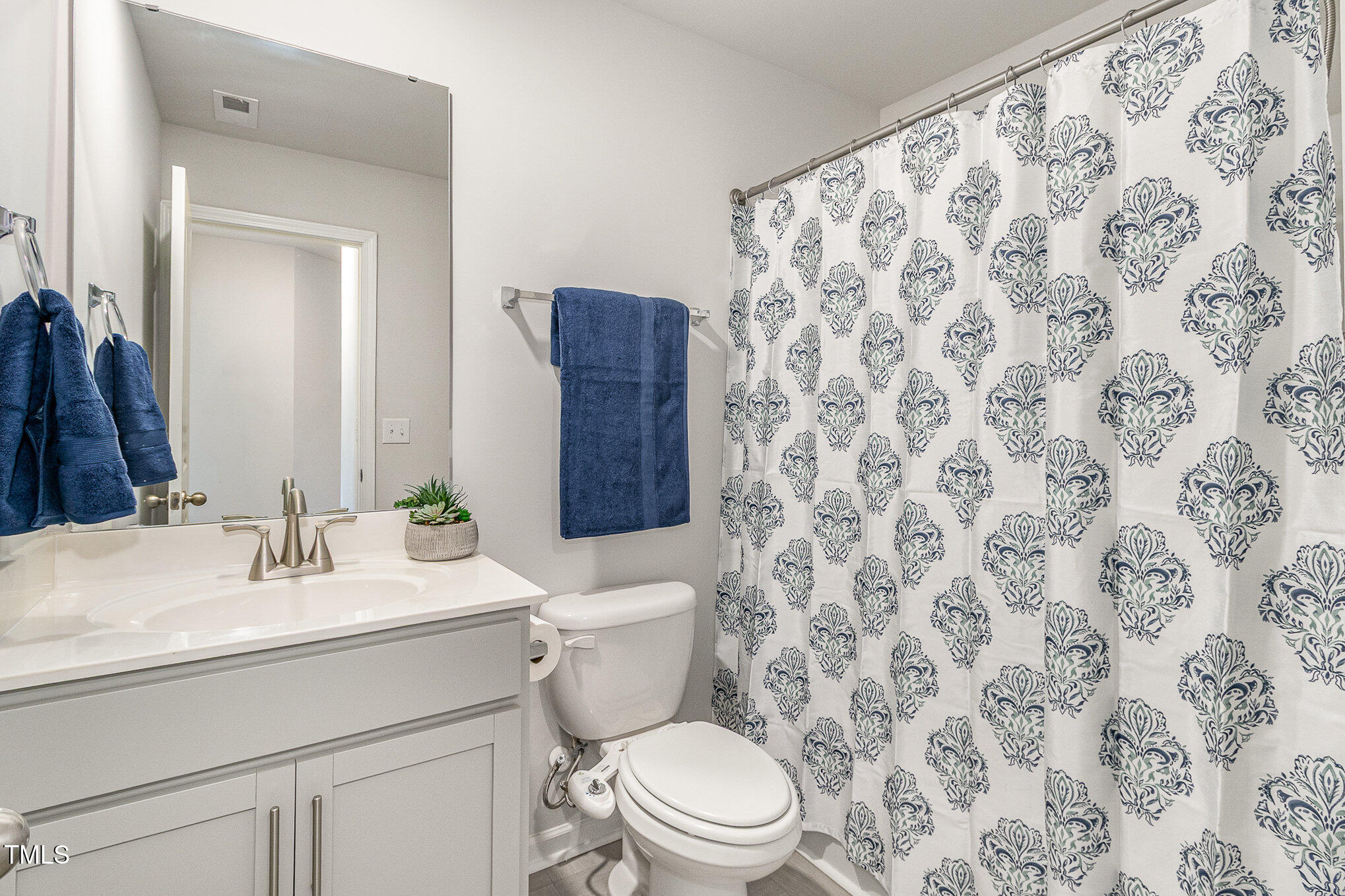 1230 Adrian Court Mebane, NC 27302 - Photo 23 of 31 a bathroom with a toilet sink and mirror