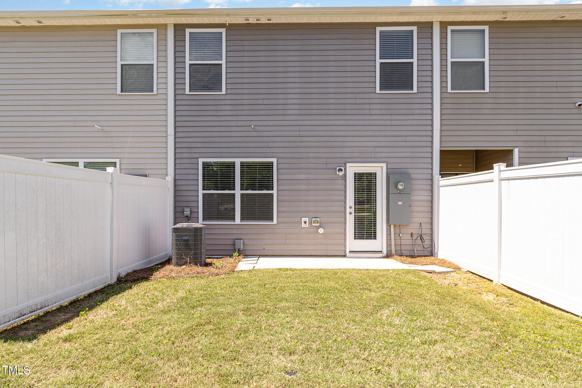 1230 Adrian Court Mebane, NC 27302 - Photo 26 of 31 a view of a house with a backyard and a table and chair