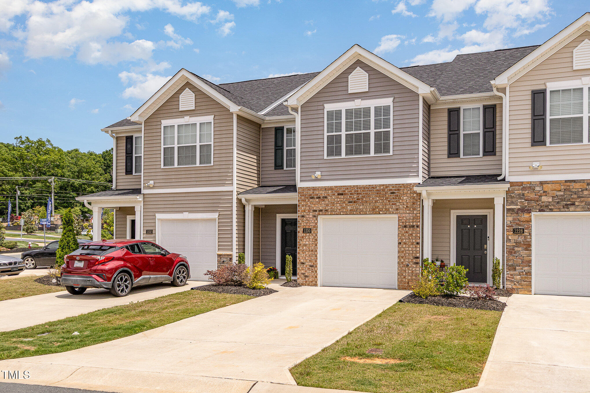 1230 Adrian Court Mebane, NC 27302 - Photo 28 of 31 a front view of a house with a yard and garage