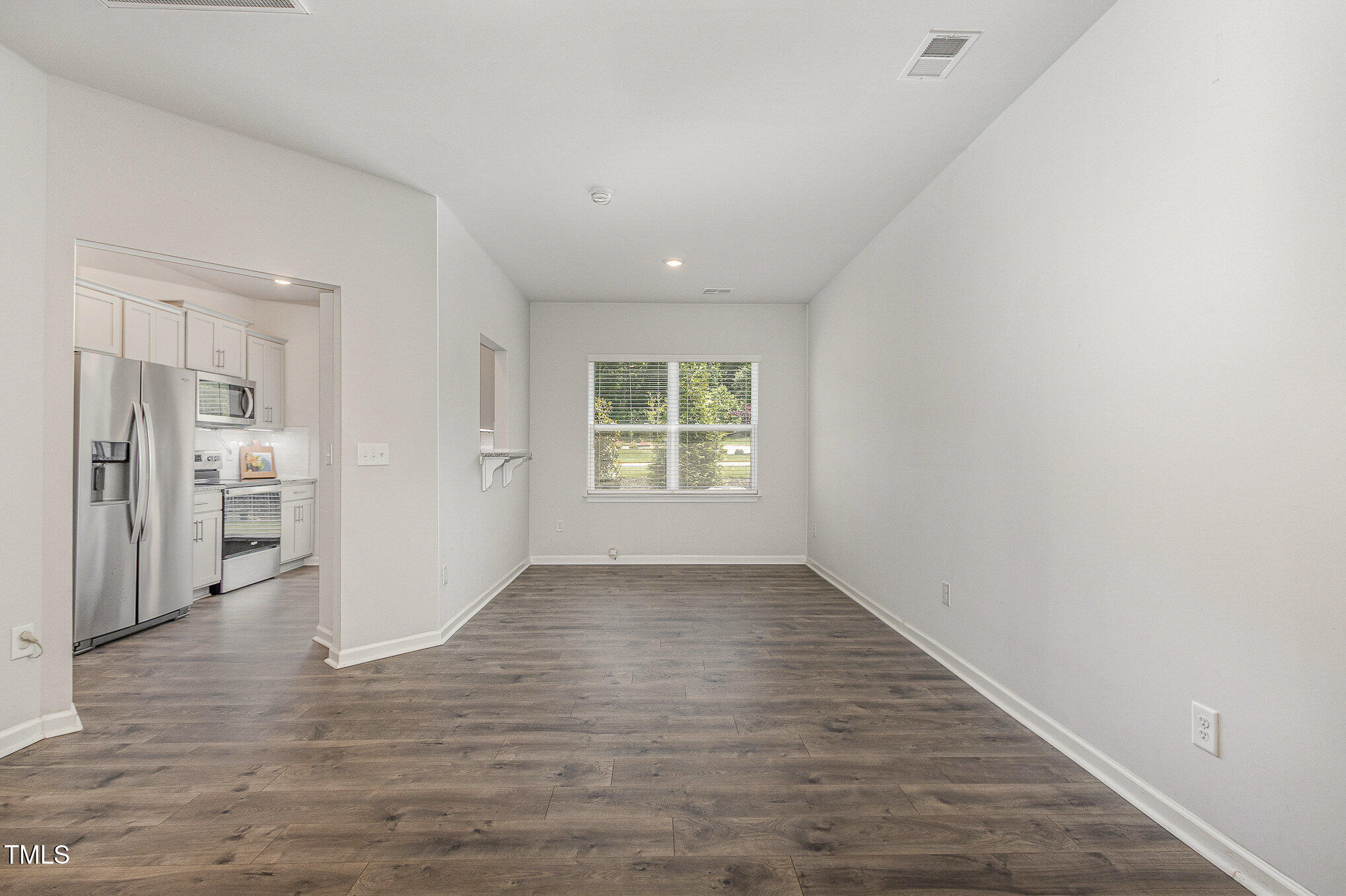 1230 Adrian Court Mebane, NC 27302 - Photo 5 of 31 wooden floor in an empty room with a window