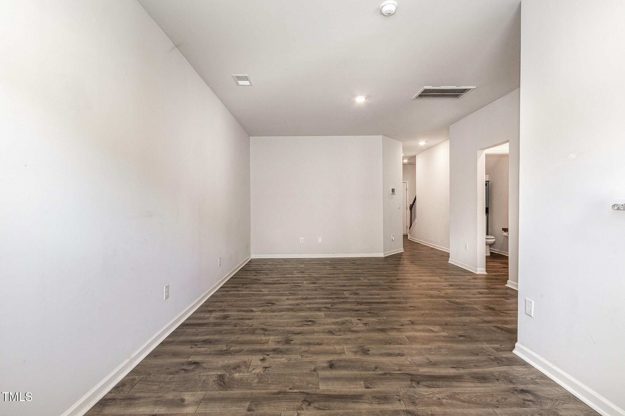 1230 Adrian Court Mebane, NC 27302 - Photo 7 of 31 a view of an empty room with wooden floor