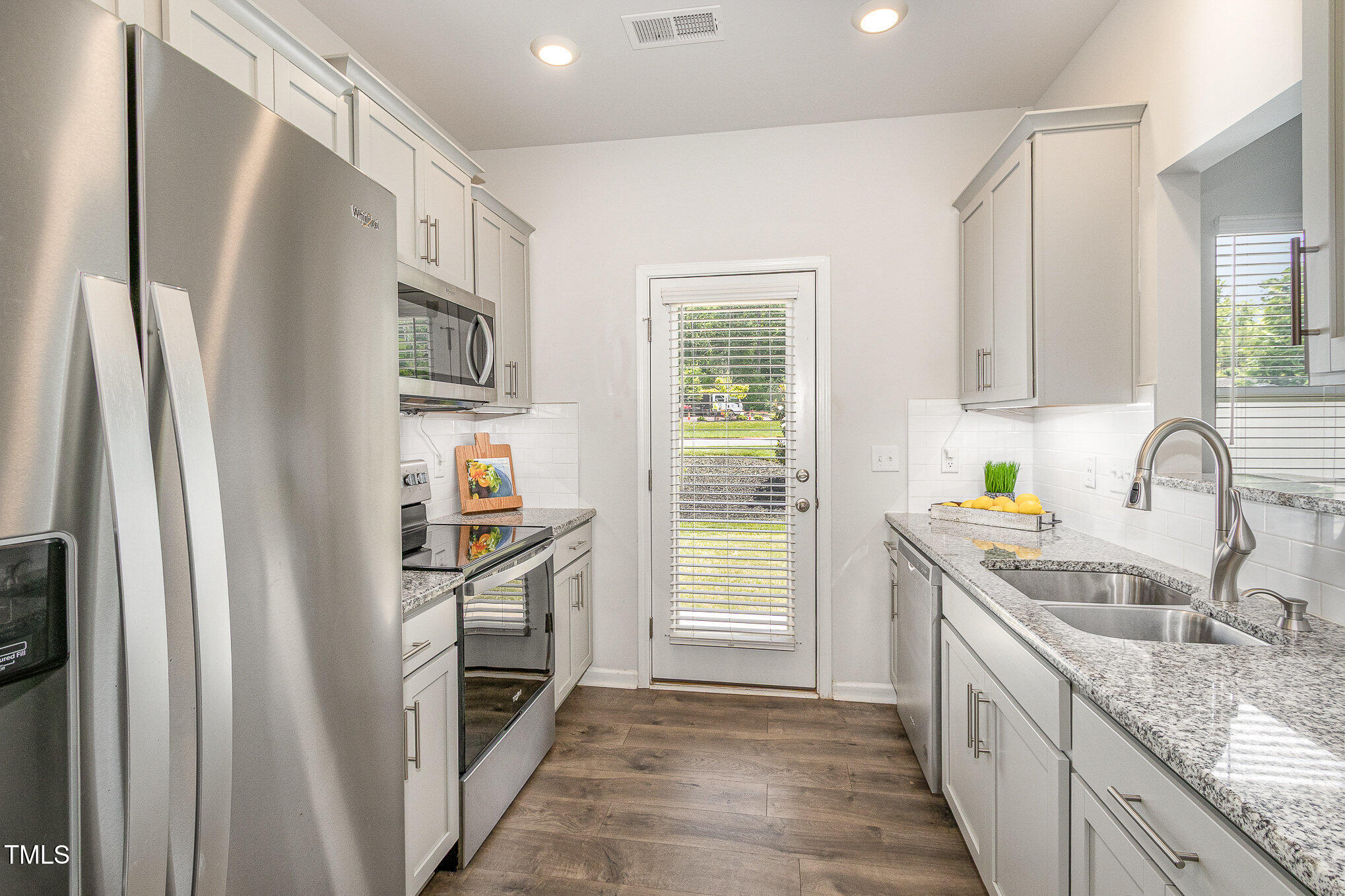 1230 Adrian Court Mebane, NC 27302 - Photo 8 of 31 a kitchen with stainless steel appliances granite countertop a refrigerator and a sink