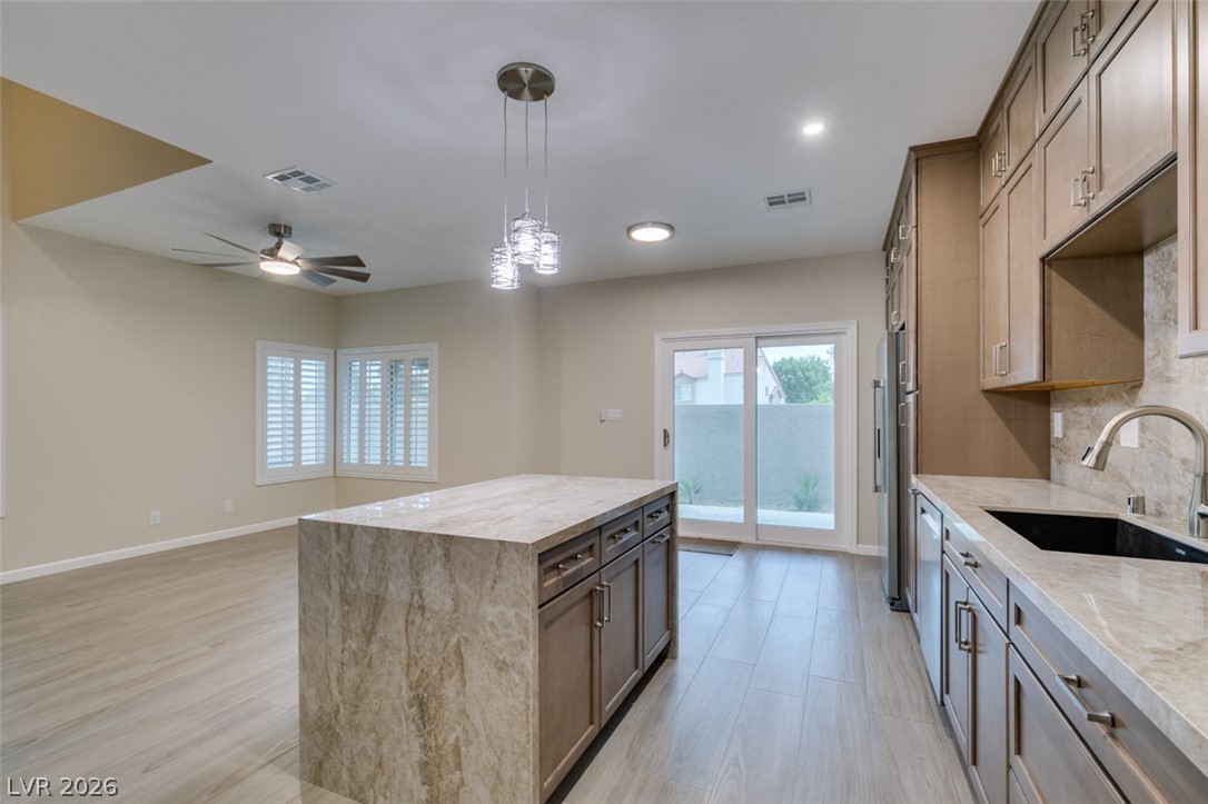 540 Sutters Mill Road Henderson, NV 89014 - Photo 31 of 46 This open concept kitchen and living area features abundant natural light.
