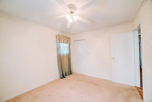 a bathroom with a toilet sink shower and mirror