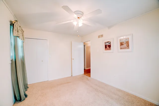 a bathroom with a shower and a toilet