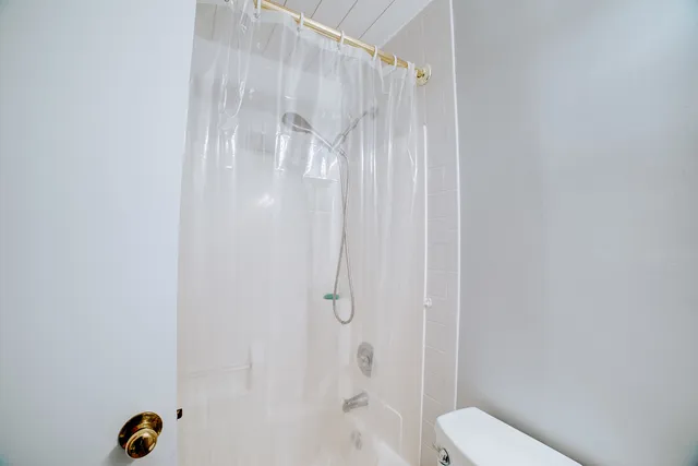 a very nice looking an empty room with a window and wooden floor