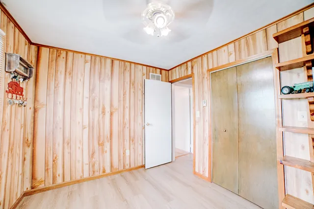 a kitchen with stainless steel appliances kitchen island granite countertop a refrigerator and a stove