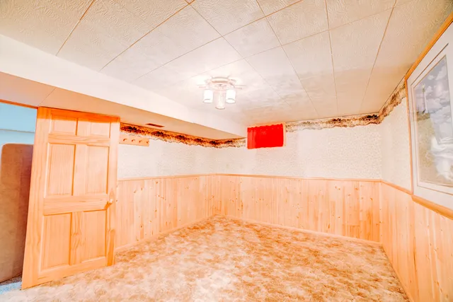 a view of outdoor space with wooden floor and windows