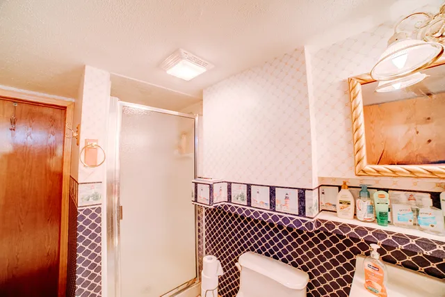 a view of a house with a yard and deck