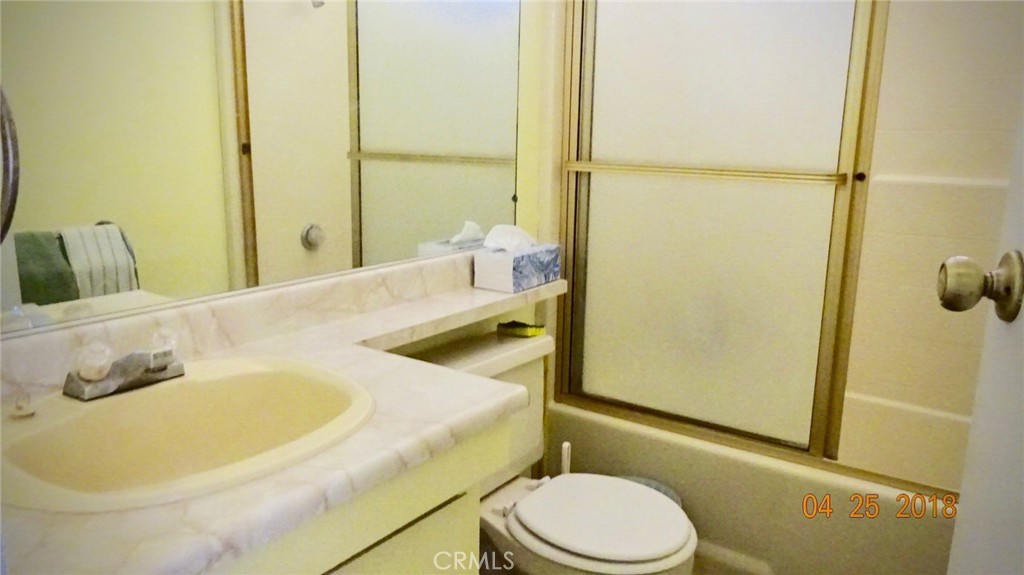 954 Bluejay Drive Santa Maria, CA 93455 - Photo 14 of 22 a bathroom with a sink and a mirror