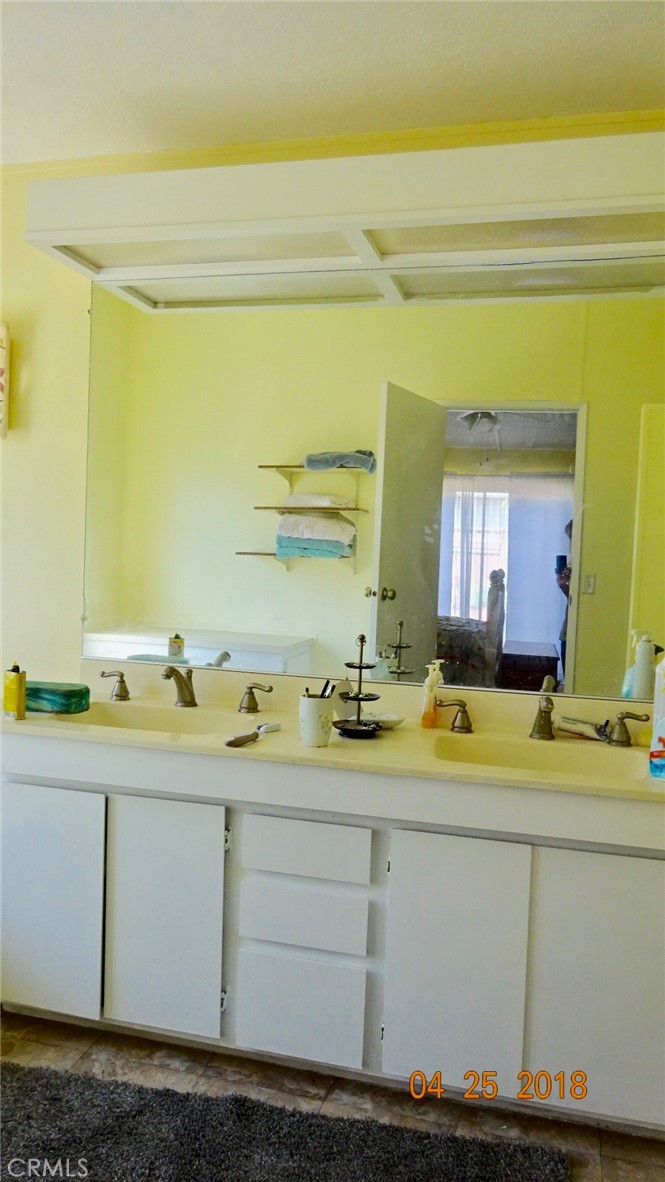 954 Bluejay Drive Santa Maria, CA 93455 - Photo 9 of 22 a bathroom with a sink and a mirror