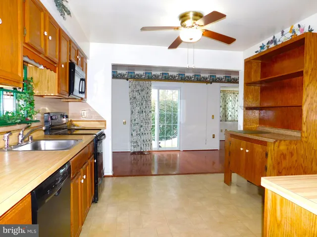 a kitchen with a cabinets and chandelier