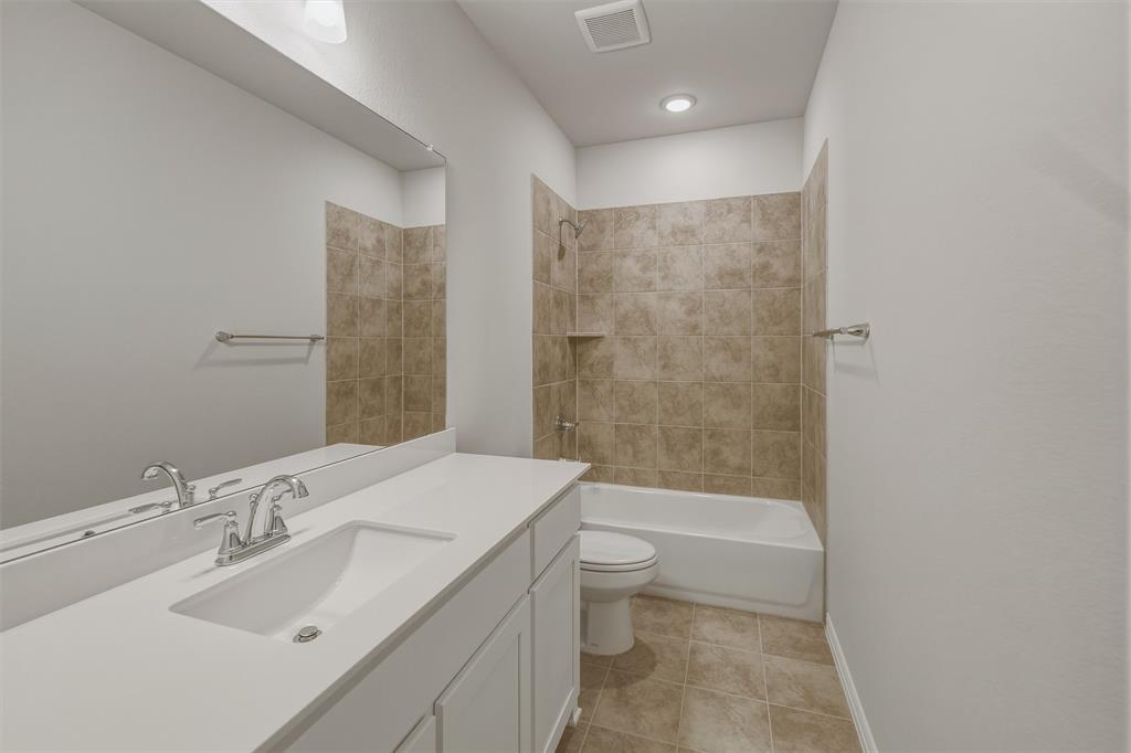 1325 Frio Drive Springtown, TX 76082 - Photo 14 of 24 Bathroom featuring a white vanity with an integrated sink, chrome faucet, and expansive mirror