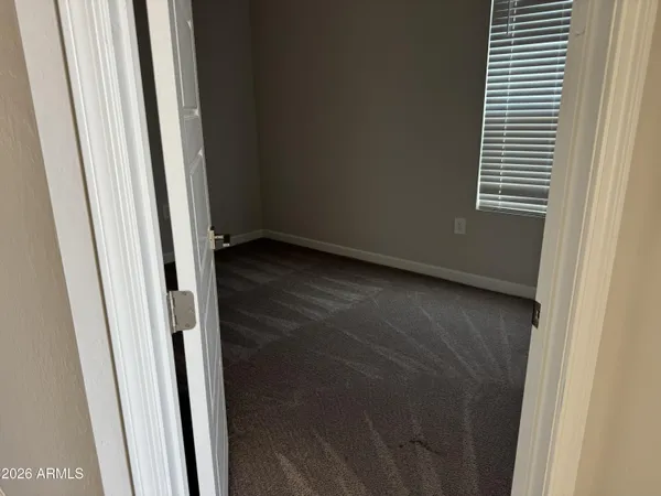 a view of an empty room and closet